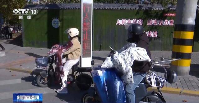 皇冠信用網会员开户_事故频发皇冠信用網会员开户！电动自行车“挡风被”到底该不该用？